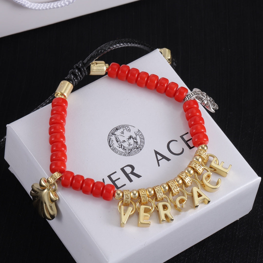 Dangle bracelet with red beads with golden letter pendant free size bracelet jewelry