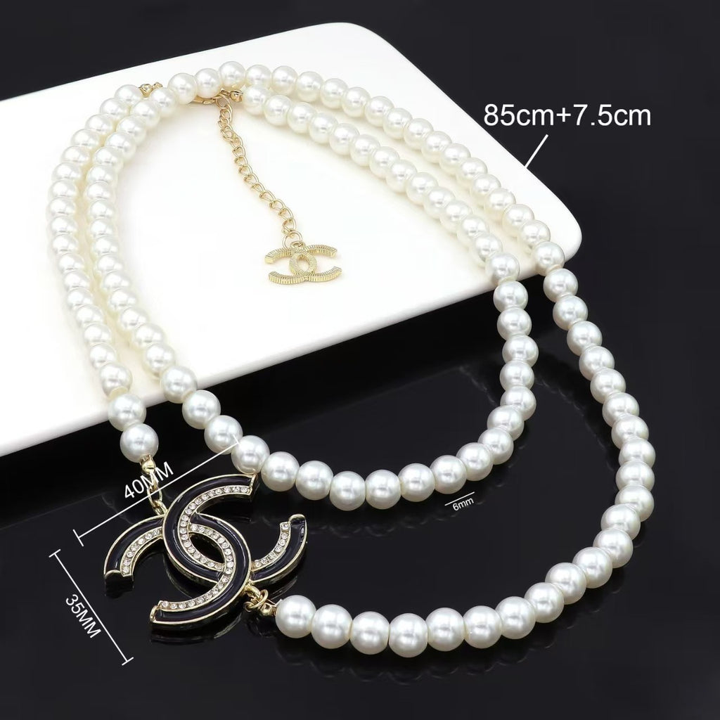 Pearls necklace double layered design with diamond in gold stacked style with white / black letter